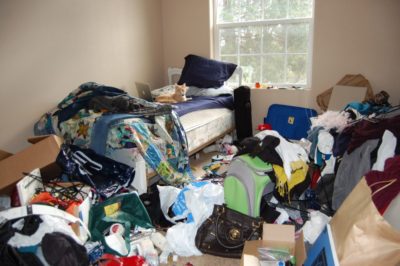 Cluttered disorganized bedroom