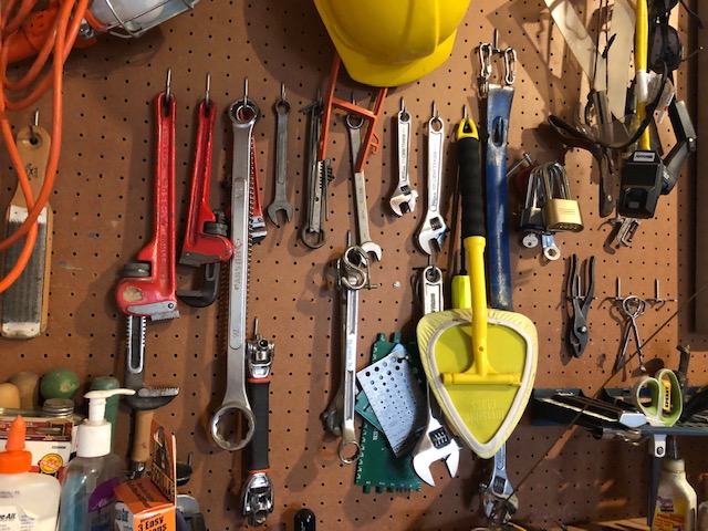 organized garage pegboard with tools