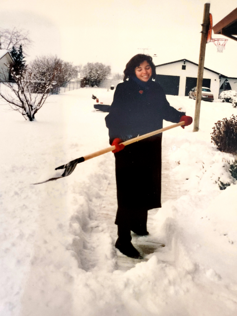 Professional Organizer Jenny Morin with black coat from a thrift store, 1990