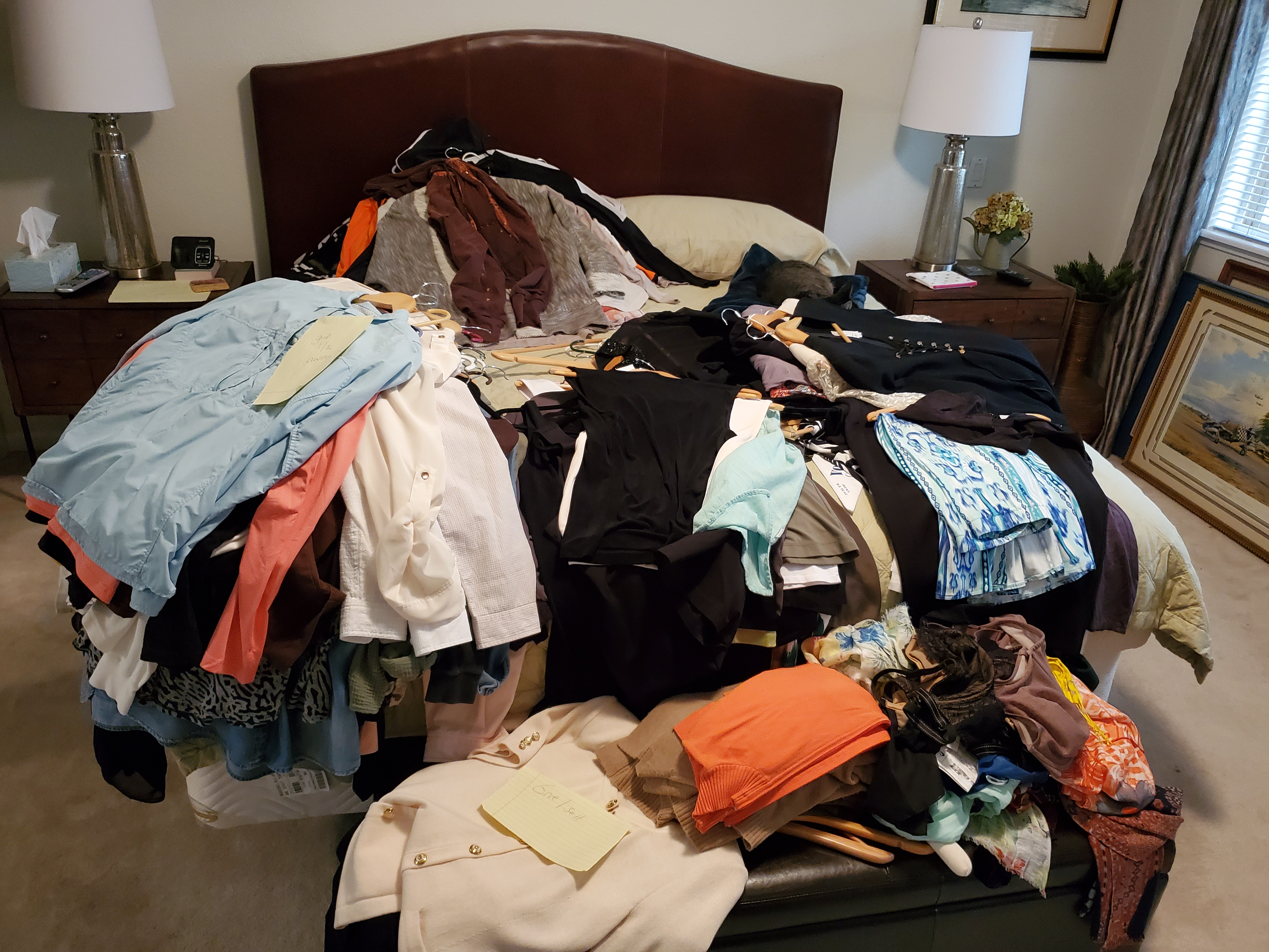Piles of clothes during closet organization